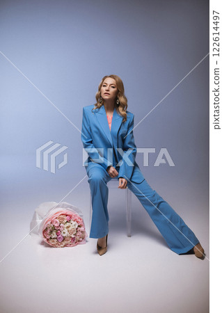 Beautiful stylish woman in a blue suit with 122614497