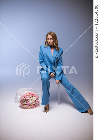 Beautiful stylish woman in a blue suit with Beautiful stylish woman in a blue suit with 122614500