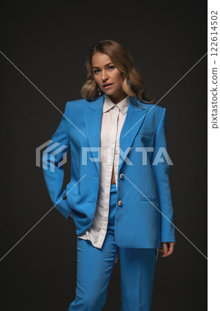 Beautiful stylish woman in a blue suit with 122614502