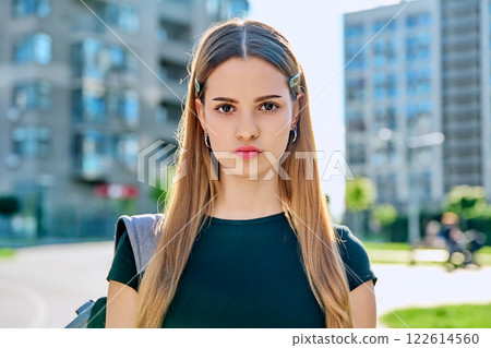 Headshot portrait serious student teenage girl with backpack outdoor 122614560