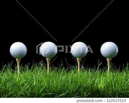 Four golf balls poised on tees in vibrant grass against a dark background 122615524