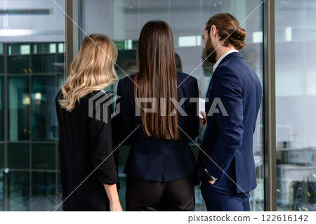 Young specialists in the office looking busy and involved 122616142