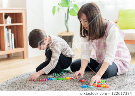 A boy studying English and a nursery teacher 122617384