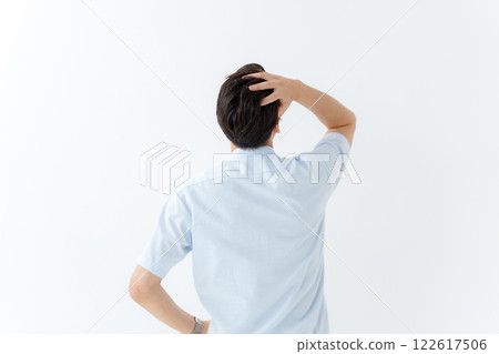 The back view of a worried businessman 122617506
