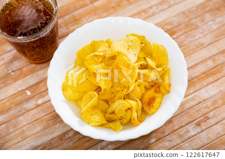 Potato chips and beer served on table 122617647