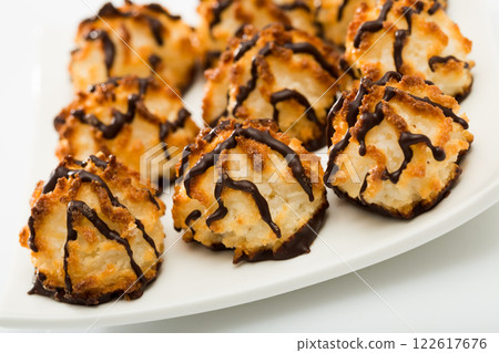 Baked coconut dessert on white plate Baked coconut dessert on white plate 122617676