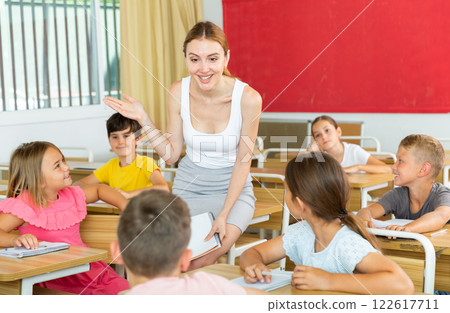 Children listening carefully to teacher Children listening carefully to teacher 122617711