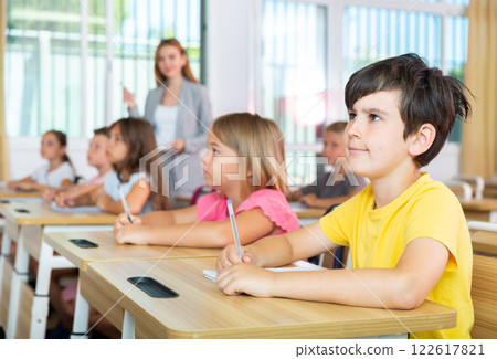 Kids studying in classroom 122617821