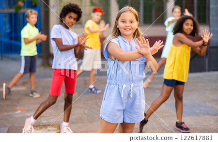 Group of kids performing street dance outdoors 122617881