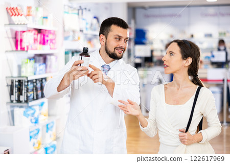Woman asking questions about medicine, druggist consultation 122617969