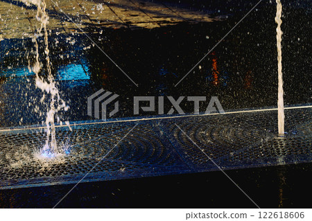 Cool water fountains flow in the heat.Hot summer 122618606