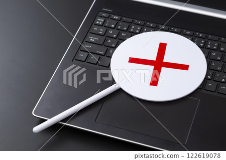 Laptop and right and wrong cards on a black background 122619078