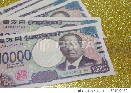 10,000 yen note Japanese yen gold background 122619481