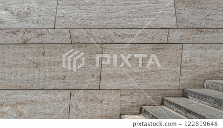 Modern Stone Wall With Adjacent Stairs for Architectural Backgrounds Modern Stone Wall With Adjacent Stairs for Architectural Backgrounds 122619648
