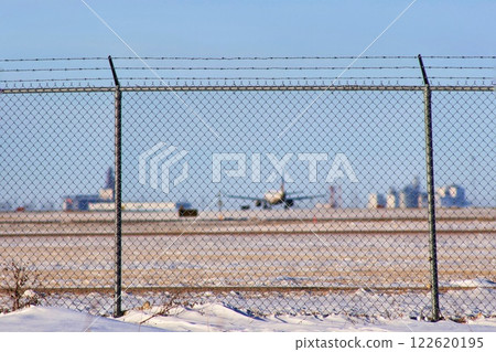 Plane on the runway in winter 122620195