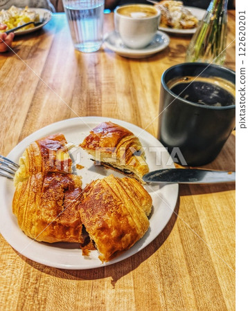 French croissant with chocolate and black coffee French croissant with chocolate and black coffee 122620201