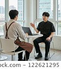 Two Men Meeting with a Laptop 122621295