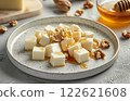 cheese on plate, cut into cubes, restaurant serving , minimalistic, copy space 122621608