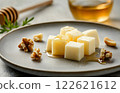 different types of cheese on plate, cut into cubes, restaurant serving with honey and nuts 122621612