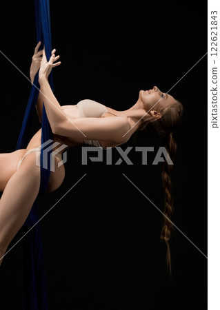 Slim girl in lingerie hanging on cloth Slim girl in lingerie hanging on cloth 122621843