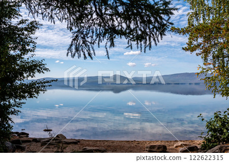 Picturesque shore of a mountain lake Picturesque shore of a mountain lake 122622315