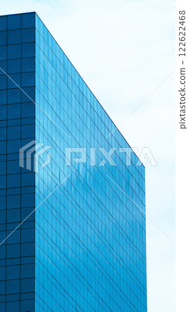Minimalist Reflection. A sleek, geometric facade capturing the essence of simplicity and modernity through sharp angles and serene reflections on a glassy surface. Minimalist Reflection. A sleek, geometric facade capturing the essence of simplicity and modernity through sharp angles and serene reflections on a glassy surface. 122622468