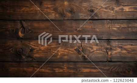 A close-up of aged wooden planks with intricate grain patterns, knots, and warm earthy tones 122623048