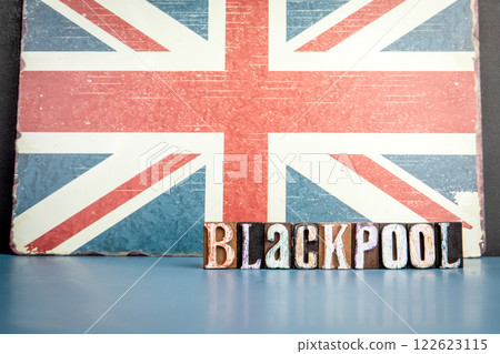BLACKPOOL. Urban Area in Great Britain. Flag and alphabet letters on wooden texture background 122623115