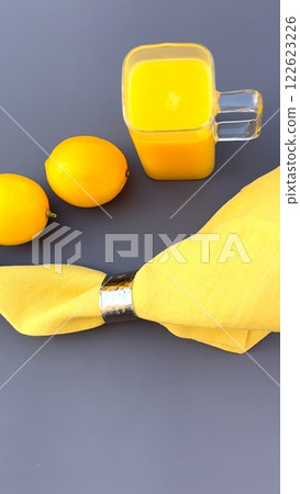 Fresh lemons exude beauty, fruit captures vitality and energy, lemons enhance organic appeal, fruit inspires wellness visuals, yellow napkin adds elegance, and lemons promote modern health concepts. 122623226