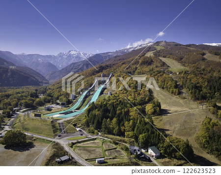 Happo-one Ski Resort and the beautiful three-tiered autumn foliage of the Hakuba mountain range, Hakuba Village, Nagano Prefecture (aerial photography by drone) Happo-one Ski Resort and the beautiful three-tiered autumn foliage of the Hakuba mountain range, Hakuba Village, Nagano Prefecture (aerial photography by drone) 122623523