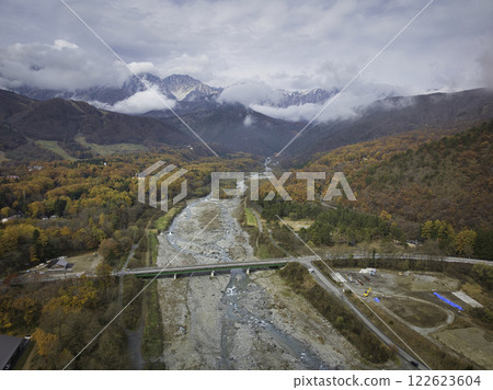 Matsukawa River and beautiful autumn leaves, Hakuba Village, Nagano Prefecture (aerial photography by drone) 122623604