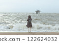 Contemplating the Waves: Solitude by the Sea 122624032