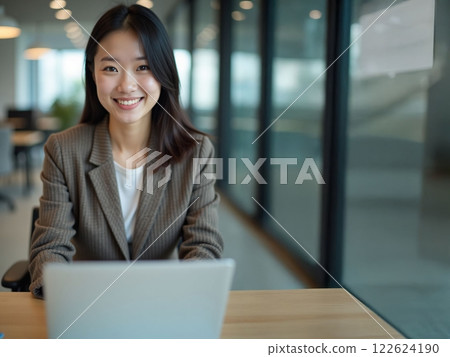 A woman heading to a computer A woman heading to a computer 122624190