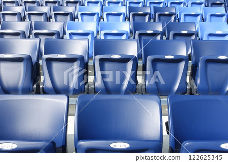 Seats lined up in the stadium 122625345