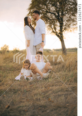 Happy family having fun in nature. Family day holiday concept 122627471