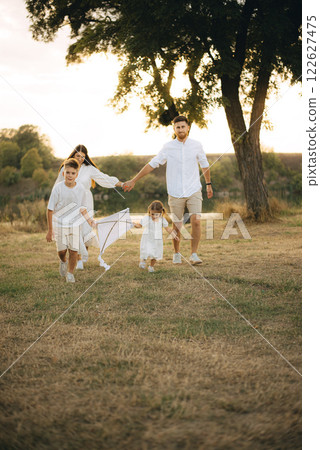 Happy family having fun in nature. Family day holiday concept 122627475