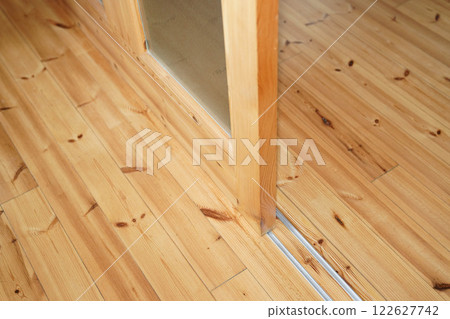 Sliding door between room of log house. Sliding door between room of log house. 122627742