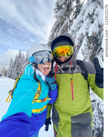 Skiers Taking Selfie on Snowy Mountain Skiers Taking Selfie on Snowy Mountain 122628376