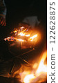 Fire pit and burning flames 122628875