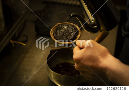 Image of hands brewing coffee with cloth drip 3 122629126