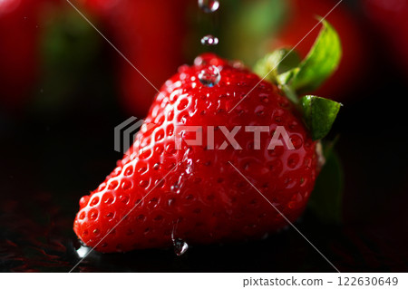 Water drops falling on strawberries 122630649