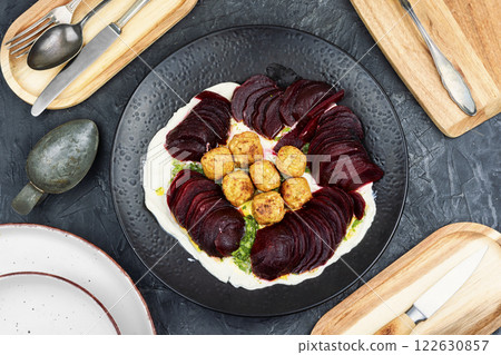 Plate of falafel balls with vegetables. 122630857