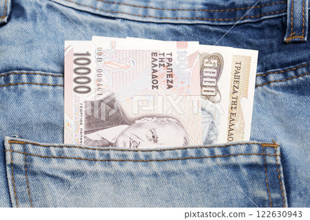 Greek Drachma in the pocket of blue jeans 122630943