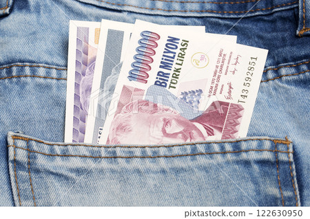 Old Turkish Lira in the pocket of blue jeans 122630950