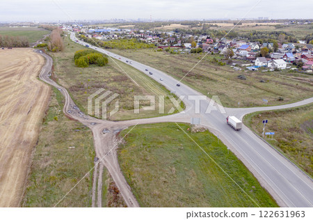 Aerial view of the roads leading to a large industrial city in Siberia in autumn Aerial view of the roads leading to a large industrial city in Siberia in autumn 122631963