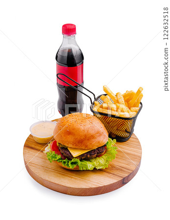 Delicious burger served with fries and a drink on a wooden board Delicious burger served with fries and a drink on a wooden board 122632518