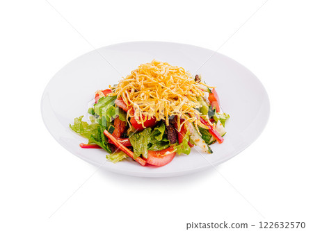 Fresh garden salad with colorful vegetables and crispy toppings served in a white dish 122632570