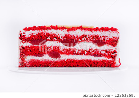 Delightful red velvet cake with layers of cream and cherries arranged beautifully for dessert presentation Delightful red velvet cake with layers of cream and cherries arranged beautifully for dessert presentation 122632693