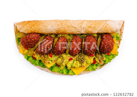 Delicious falafel wrap filled with fresh ingredients and colorful toppings Delicious falafel wrap filled with fresh ingredients and colorful toppings 122632782