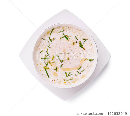 Creamy garlic dip garnished with fresh herbs served in a square dish Creamy garlic dip garnished with fresh herbs served in a square dish 122632949